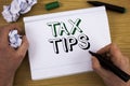 Handwriting text Tax Tips. Concept meaning Help Ideas for taxation Increasing Earnings Reduction on expenses Concept For Informati