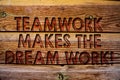 Handwriting text Teamwork Makes The Dream Work Call. Concept meaning Camaraderie helps achieve success Wooden background vintage w