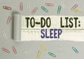 Handwriting text To Do List Sleep. Concept meaning Things to be done Priority object is to take a rest Paper clip and