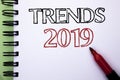 Handwriting text Trends 2019. Concept meaning Current Movement Latest Branding New Concept Prediction written on Notebook Book on