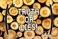 Handwriting text Truth Or Lies. Concept meaning Decide between a fact or telling a lie Doubt confusion Wooden background Royalty Free Stock Photo