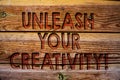 Handwriting text Unleash Your Creativity Call. Concept meaning Develop Personal Intelligence Wittiness Wisdom Wooden background vi Royalty Free Stock Photo