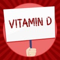 Handwriting text Vitamin D. Concept meaning Benefits of sunbeam exposure and certain fat soluble nutriments Hand Holding