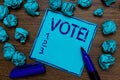 Handwriting text Vote Motivational Call. Concept meaning Formalized decision on important matters electing Cyan paper imagination