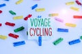 Handwriting text Voyage Cycling. Concept meaning Use of bicycles for transport recreation and exercise Colored clothespin papers Royalty Free Stock Photo