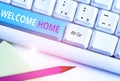 Handwriting text Welcome Home. Concept meaning Expression Greetings New Owners Domicile Doormat Entry White pc keyboard