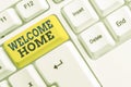 Handwriting text Welcome Home. Concept meaning Expression Greetings New Owners Domicile Doormat Entry White pc keyboard