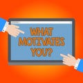 Handwriting text What Motivates You. Concept meaning provide someone with reason for doing something Hu analysis Hands from Both