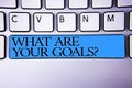 Handwriting text What Are Your Goals Question. Concept meaning asking someone about his life targets Alphabetic buttons blue space Royalty Free Stock Photo