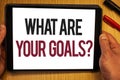 Handwriting text What Are Your Goals Question. Concept meaning asking someone about his life targets Hand hold showing colorful le Royalty Free Stock Photo