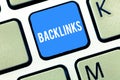 Handwriting text writing Backlinks. Concept meaning incoming hyperlink from one web page to another big website Keyboard