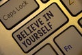 Handwriting text writing Believe In Yourself. Concept meaning Determination Positivity Courage Trust Faith Belief Golden keyboard