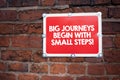 Handwriting text writing Big Journeys Begin With Small Steps. Concept meaning One step at a time to reach your goals. Royalty Free Stock Photo