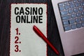 Handwriting text writing Casino Online. Concept meaning Computer Poker Game Gamble Royal Bet Lotto High Stakes Piece paper red bor