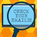 Handwriting text writing Check Your Emails. Concept meaning have look at your inbox to see new mails and read Magnifying