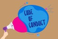 Handwriting text writing Code Of Conduct. Concept meaning Ethics rules moral codes ethical principles values respect Man holding M Royalty Free Stock Photo