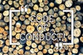 Handwriting text writing Code Of Conduct. Concept meaning Follow principles and standards for business integrity Wooden