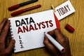 Handwriting text writing Data Analysts. Concept meaning Programmer Design and Create Report Identifies patterns Man holding marker Royalty Free Stock Photo
