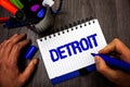 Handwriting text writing Detroit. Concept meaning City in the United States of America Capital of Michigan Motown Man hold holding