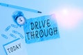 Handwriting text writing Drive Through. Concept meaning place where you can get type of service by driving through it Alarm clock