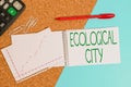 Handwriting text writing Ecological City. Concept meaning huanalysis settlement modeled on the self sustaining structure Desk