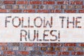 Handwriting text writing Follow The Rules. Concept meaning act in agreement or compliance with obey them Firmly Brick