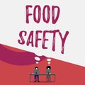 Handwriting text writing Food Safety. Concept meaning conditions and practices that preserve the quality of food Two men