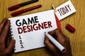 Handwriting text writing Game Designer. Concept meaning Campaigner Pixel Scripting Programmers Consoles 3D Graphics Man holding ma Royalty Free Stock Photo