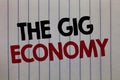 Handwriting text writing The Gig Economy. Concept meaning Market of Short-term contracts freelance work temporary white vertical p