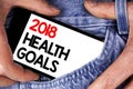 Handwriting text writing 2018 Health Golas. Concept meaning new year plan Workout healthy food Resolution goals written on Mobile Royalty Free Stock Photo