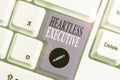 Handwriting text writing Heartless Executive. Concept meaning workmate showing a lack of empathy or compassion. Royalty Free Stock Photo