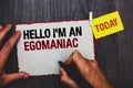 Handwriting text writing Hello I am An Egomaniac. Concept meaning Selfish Egocentric Narcissist Self-centered Ego Hand grip black Royalty Free Stock Photo