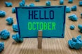 Handwriting text writing Hello October. Concept meaning Last Quarter Tenth Month 30days Season Greeting Clothespin holding blue pa