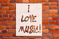 Handwriting text writing I Love Music. Concept meaning Having affection for good sounds lyric singers musicians Brick