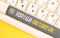 Handwriting text writing Keep Calm And Carry On. Concept meaning slogan calling for persistence face of challenge White pc Royalty Free Stock Photo