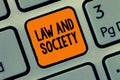 Handwriting text writing Law And Society. Concept meaning Address the mutual relationship between law and society