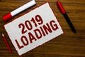 Handwriting text writing 2019 Loading. Concept meaning Advertising the upcoming year Forecasting the future event White paper red Royalty Free Stock Photo