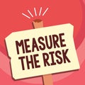 Handwriting text writing Measure The Risk. Concept meaning determine degree of danger based on impact factors Royalty Free Stock Photo