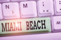 Handwriting text writing Miami Beach. Concept meaning the coastal resort city in MiamiDade County of Florida White pc