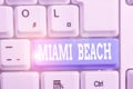 Handwriting text writing Miami Beach. Concept meaning the coastal resort city in MiamiDade County of Florida White pc