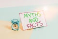 Handwriting text writing Myths And Facts. Concept meaning Oppositive concept about modern and ancient period Mini size