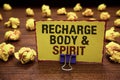 Handwriting text writing Recharge BodyandSpirit. Concept meaning fill your energy through relaxation and having fun Yellow sticky