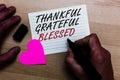 Handwriting text writing Thankful Grateful Blessed. Concept meaning Appreciation gratitude good mood attitude Written on notepad h Royalty Free Stock Photo