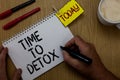 Handwriting text writing Time To Detox. Concept meaning Moment for Diet Nutrition health Addiction treatment cleanse Man holding m Royalty Free Stock Photo