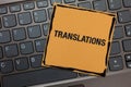 Handwriting text writing Translations. Concept meaning Written or printed process of translating words text voice Black laptop key