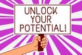 Handwriting text writing Unlock Your Potential. Concept meaning improve self awareness Skills to Achieve more Man hand holding pos Royalty Free Stock Photo