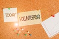 Handwriting text writing Volunteering. Concept meaning Provide services for no financial gain Willingly Oblige Corkboard