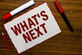Handwriting text writing What s is Next. Concept meaning Asking whatever comes immediately after the present one White paper red b Royalty Free Stock Photo