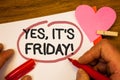 Handwriting text Yes, It'S Friday Motivational Call. Concept meaning having weekend Taking rest break Human hand retain red pen c Royalty Free Stock Photo