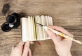 Handwritten diary: woman holding hardcover notebook